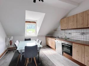 Kuchyň nebo kuchyňský kout v ubytování Up Residences S