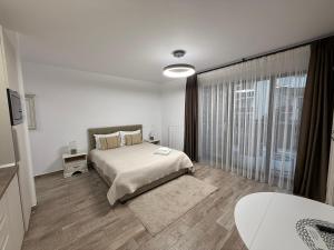 En eller flere senge i et værelse på The View Studio Busteni