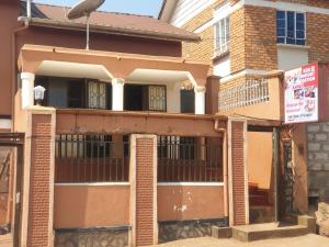 an old building with a gate in front of it at KBK Comfort Accommodation in Kampala +13 photos