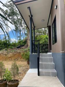 a set of stairs leading to a house with trees at Baan klang suan at kantiang bay in Ko Lanta +3 photos