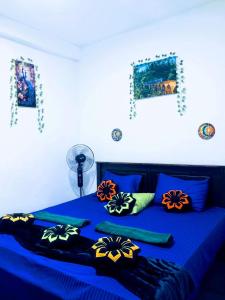 Ένα ή περισσότερα κρεβάτια σε δωμάτιο στο Ella Dilshan Homestay