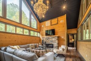 a living room with a couch and a fireplace at Multi Level Getaway Pool Hot Tub and Fireplace in Pittman Center