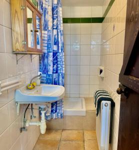 a small bathroom with a sink and a toilet at Cornaro House in Arsos +63 photos