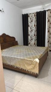Ένα ή περισσότερα κρεβάτια σε δωμάτιο στο Gupta Cottage