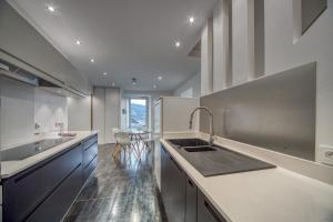 a kitchen with a sink and a counter at MEYLAN - Malacare in Meylan