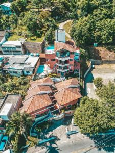 an aerial view of a resort with a water park at Stúdio Jurerê vista Mar in Florianópolis +68 photos