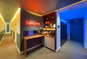 a kitchen with a counter and a sign on the wall at Ópera Stays by Charming in Madrid +19 photos