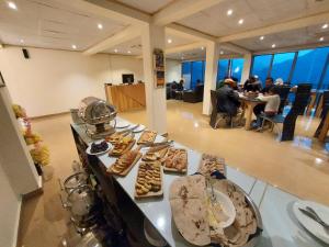 a buffet line with different types of pastries on it at Hunza Hard Rock Resort in Baltit