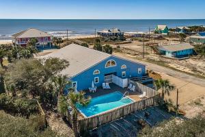 an overhead view of a blue house with a swimming pool at Neptunes Palace A1 in Saint George Island