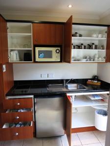 Kjøkken eller kjøkkenkrok på ASURE Ascot Motor Inn