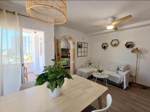 a living room with a table and a couch at Vistas al mar in Miramar