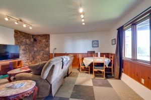 a living room with a couch and a table at Fish and Hike! Home Base for Kachemak Bay Adventures in Homer
