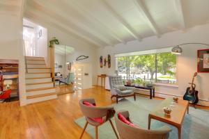 a living room with a table and chairs at 12 Mi to Denver Home with Game Room in Wheat Ridge in Wheat Ridge