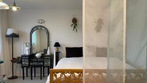 a bedroom with a canopy bed and a mirror at Secret Villa Seoul , Korean Traditional and morden mix Design in Seoul +53 photos