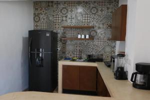 Η κουζίνα ή μικρή κουζίνα στο Departamento en San Sebastián Mérida +2 φωτογραφίες