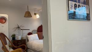 a bedroom with a bed and a picture on the wall at Secret Villa Seoul , Korean Traditional and morden mix Design in Seoul