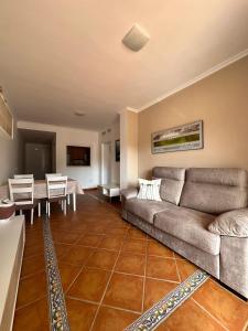 a living room with a couch and a table at Spirit of Mojacar Playa Resort in Mojácar