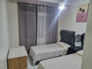Ένα ή περισσότερα κρεβάτια σε δωμάτιο στο Votre Appartement de Vacances en Plein Cœur Tanger