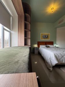 a bedroom with a bed and a book shelf at Eddys in Chihuahua