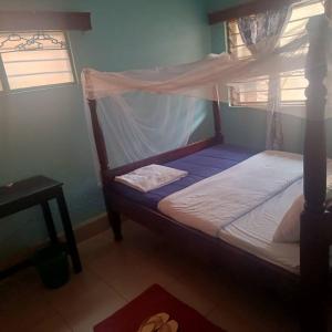 Ένα ή περισσότερα κρεβάτια σε δωμάτιο στο Oval Guest House