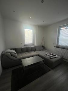 a living room with a couch and a coffee table at Sunshine in Groß-Zimmern