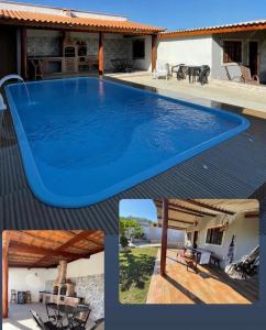 a large blue swimming pool on top of a house at Chácara vó Zenilda in Itatiaia