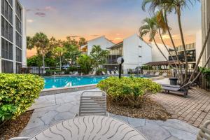 an image of a swimming pool at a resort at Coastal Condo, Water Views, Fishing Dock & 0.6 Miles to Siesta Beach in Siesta Key