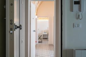 Postel nebo postele na pokoji v ubytování Dimora Donna Lucia