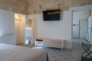 TV a/nebo společenská místnost v ubytování Dimora Donna Lucia