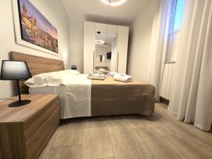 Ένα ή περισσότερα κρεβάτια σε δωμάτιο στο Maison Zisa - Proppro SRL - Palermo