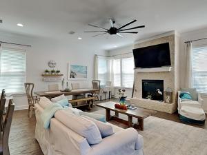 a living room with a couch and a fireplace at Emerald Escape in Blue Gulf Beach