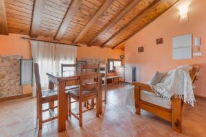 a living room with a table and a couch at Apartamentos Casa La Cuca in Alfambra