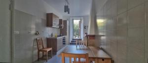 a kitchen with a table and chairs in a room at Affittacamere Laura in Orvieto