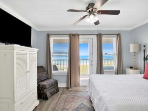 a bedroom with a bed and a ceiling fan at Serenity Eden in Perdido Key