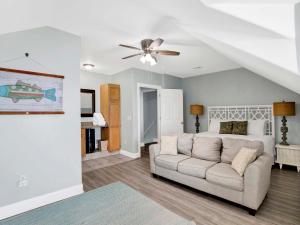 a living room with a couch and a bed at Serenity Eden in Perdido Key