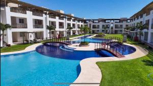 an image of a swimming pool at a resort at SW Rustica Apartamentos in Canoa Quebrada