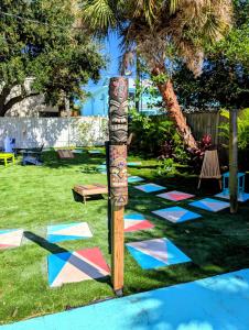 a game of hopscotch on the grass in a yard at 2 Minute Walk to Beach & Downtown! in Cocoa Beach