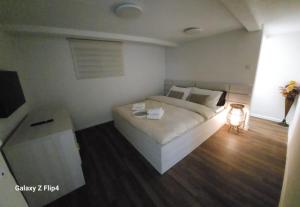 Ένα ή περισσότερα κρεβάτια σε δωμάτιο στο Guest Suite SUZY