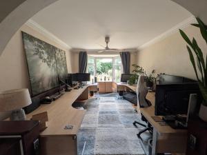 an office with a long row of desks and computers at Aberfall Private Luxury Villa Indoor Pool Hot Tub Gym Cinema in Goxhill