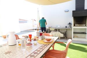 a table with food on top of a patio at Casa do Campinho B&B boutique country house in Reguengos de Monsaraz