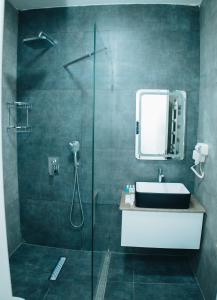 a bathroom with a shower and a sink and a mirror at AS Hotel Ganja in Ganja +44 photos