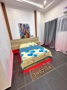 a bedroom with a bed sitting on a tiled floor at OccaLuxe in Adgénou