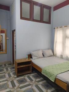 Postel nebo postele na pokoji v ubytování Sirful Homestay