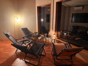 a group of chairs sitting in a room at 美祢Terrace in Mine
