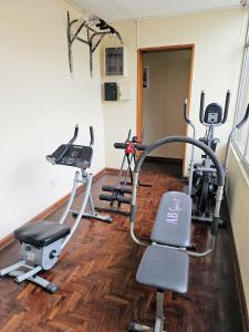 a gym with several exercise bikes in a room at Casa Navarra in Lima