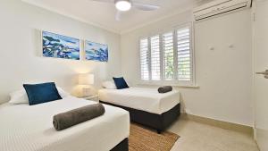 En eller flere senge i et værelse på Pelican Shore Villa 21 - Kalbarri, WA + 5 billeder