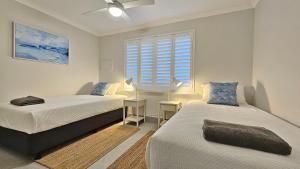 Postel nebo postele na pokoji v ubytování Pelican Shore Villa 3- Kalbarri, WA + 1 fotografie