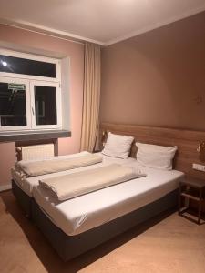 Ένα ή περισσότερα κρεβάτια σε δωμάτιο στο Hotel Orange