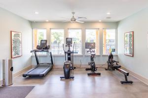 a gym with several treadmills and exercise bikes at Oceans RV Resort in Holly Ridge