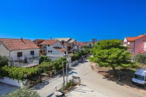 a street in a residential neighborhood with houses at Apartments with parking space Srima - Vodice, Vodice - 23593 in Srima